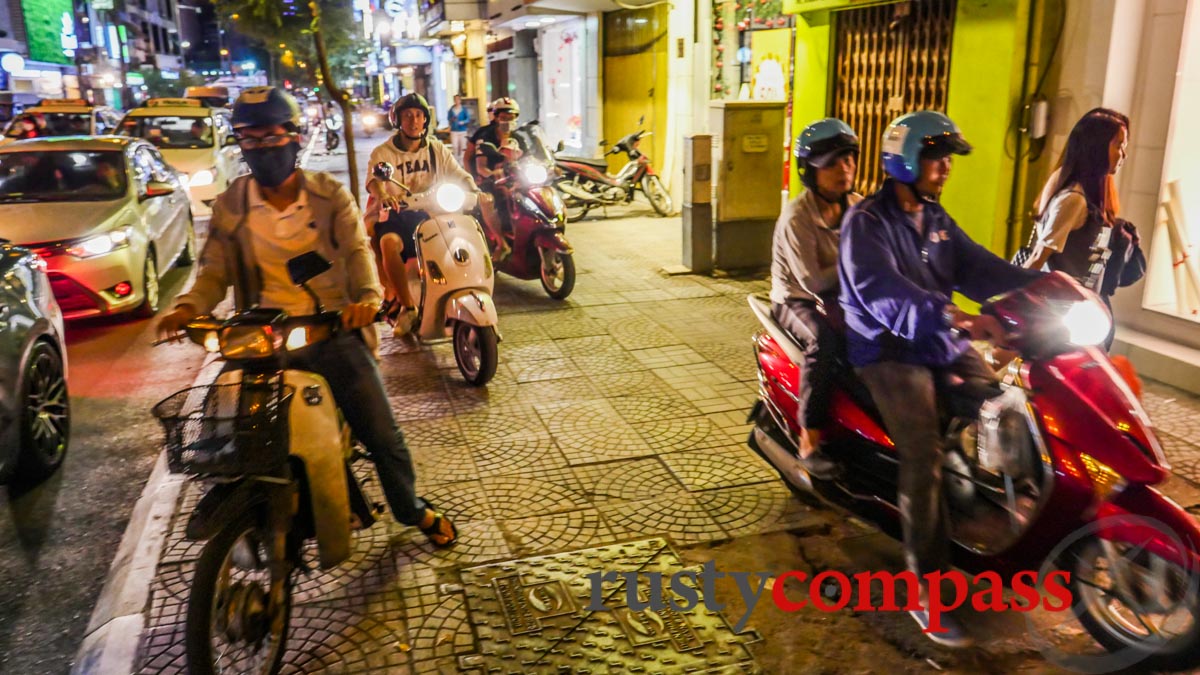 Saigon pavements - motorcycles increase their speeds at night.